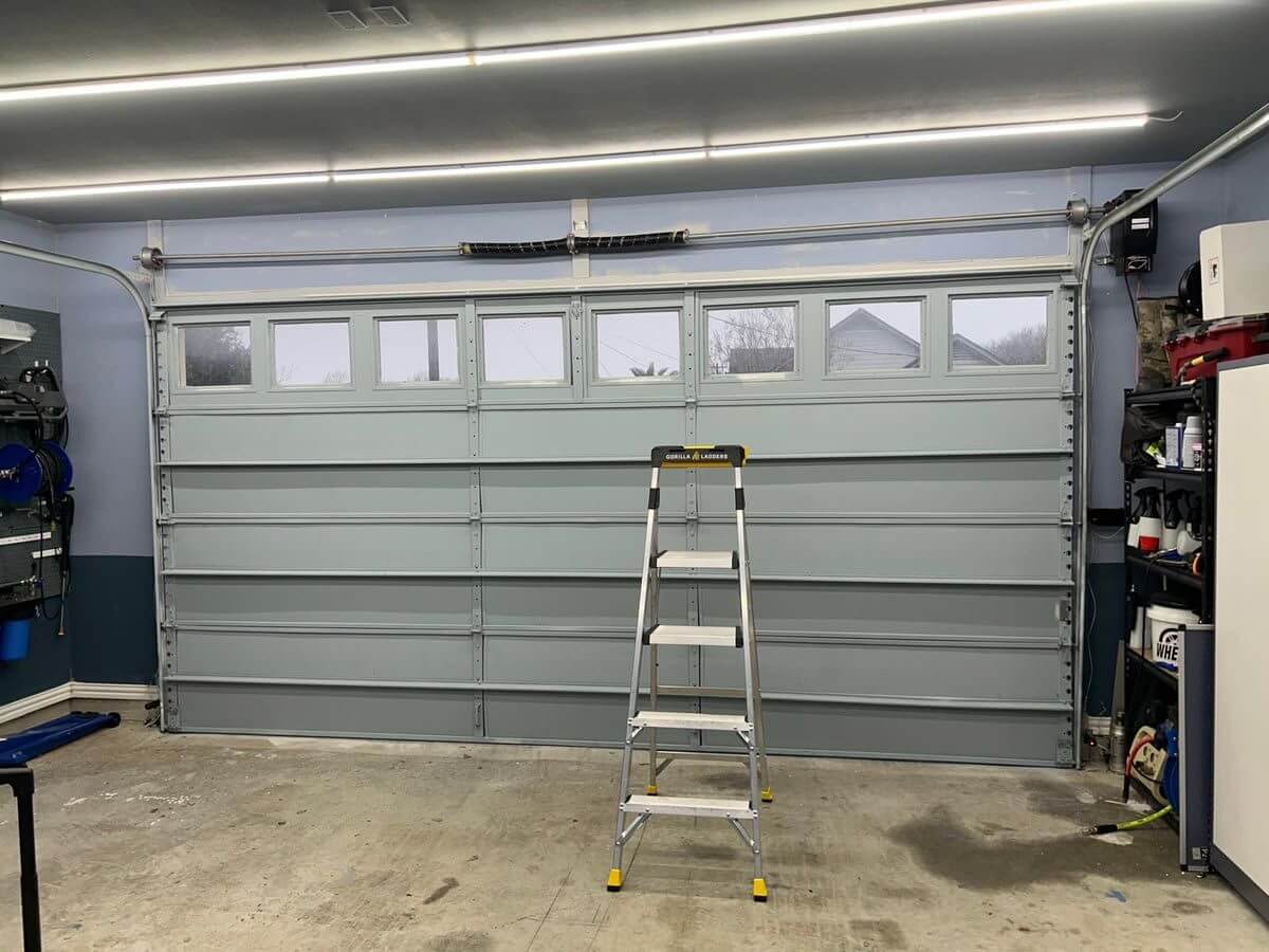 Blue-gray garage door with windows interior view