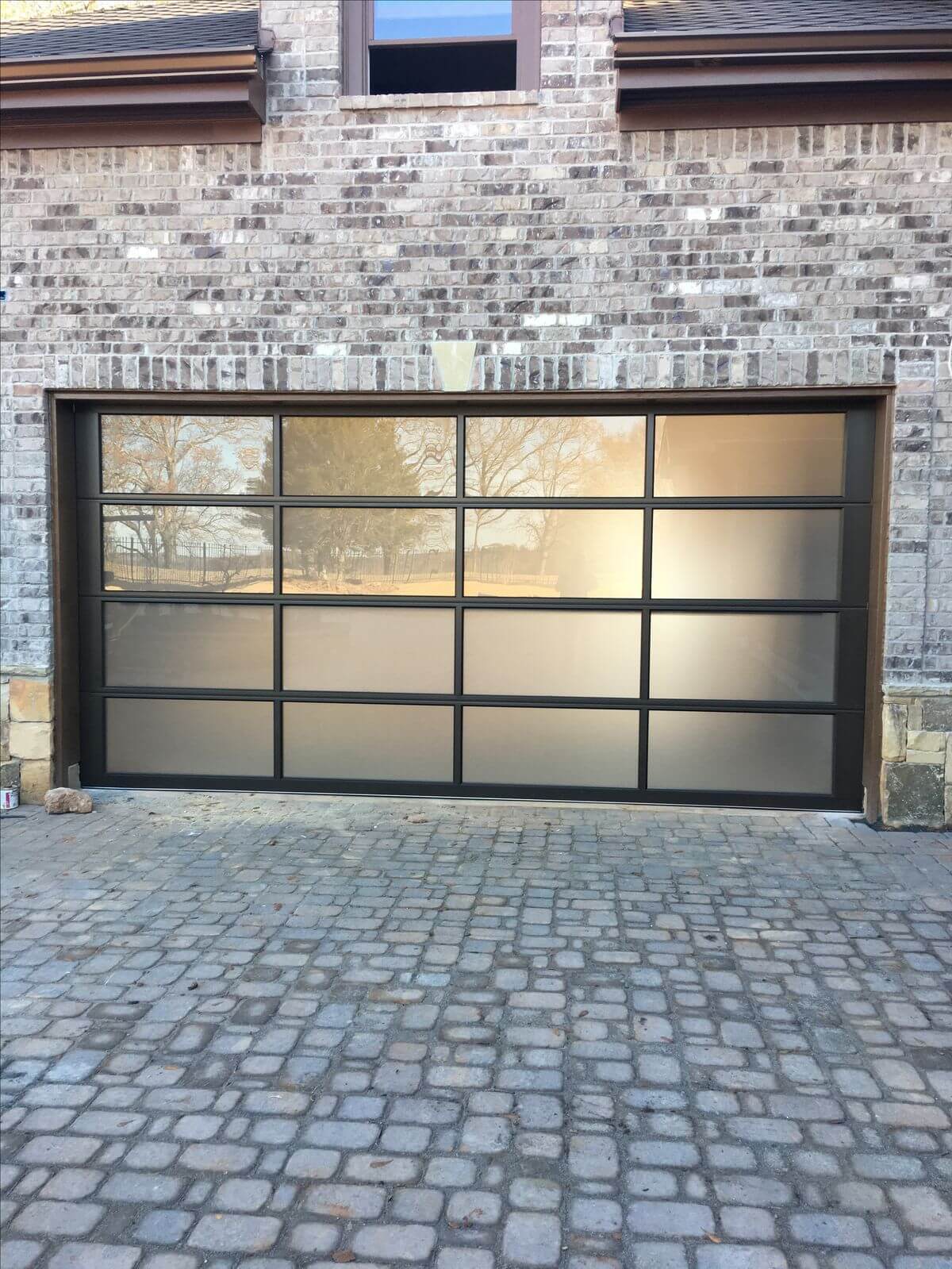 Modern glass and aluminum full-view garage door