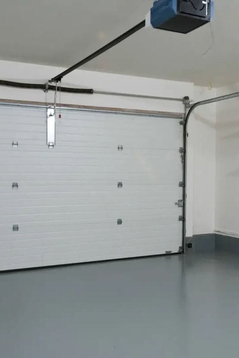 Clean white garage door interior with opener
