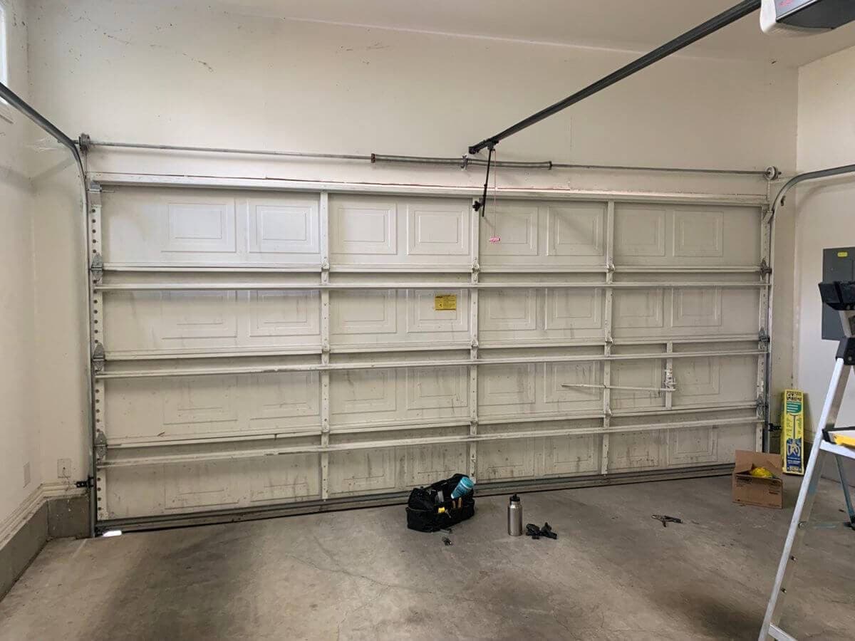 Wide garage door repair in progress